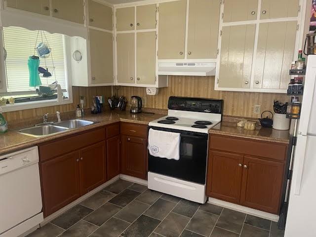 kitchen with sink and white appliances