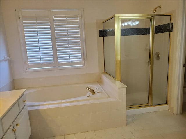 bathroom featuring vanity, independent shower and bath, and tile patterned flooring