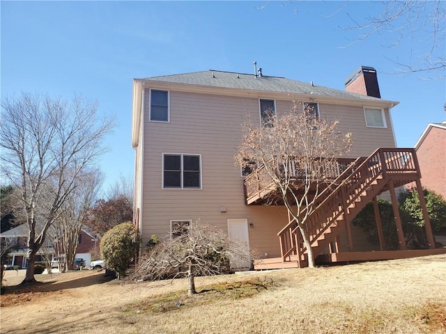 back of house featuring a wooden deck