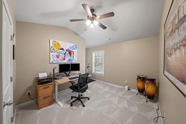 office featuring lofted ceiling, light carpet, ceiling fan, and baseboards