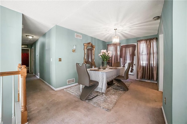 carpeted dining space with a notable chandelier