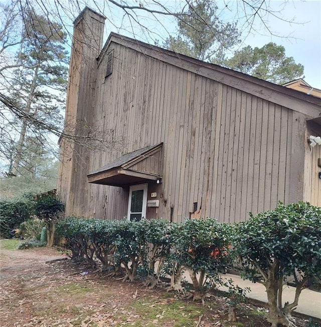 view of side of property featuring a chimney