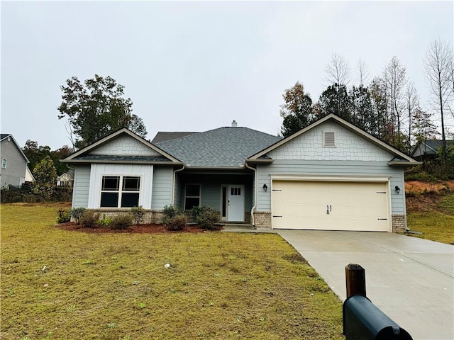 view of front facade featuring a front lawn and a garage