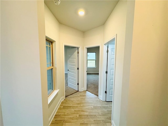 hall with light wood-type flooring