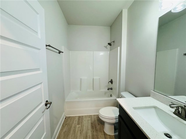 full bathroom with hardwood / wood-style floors, vanity, toilet, and shower / bathtub combination