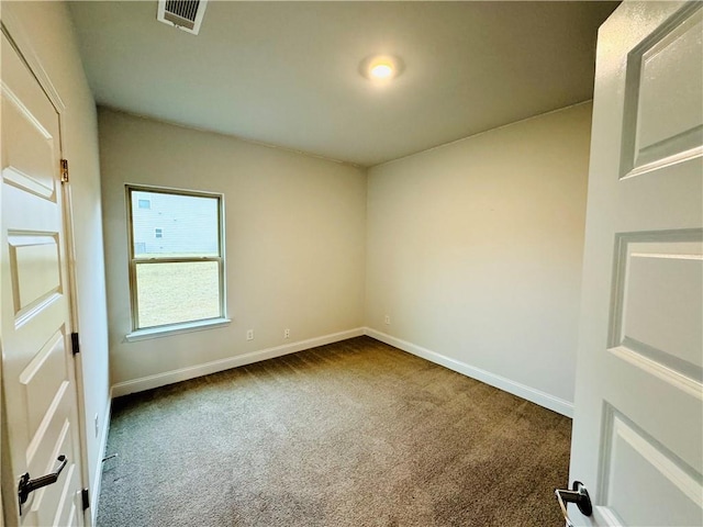 empty room with carpet flooring