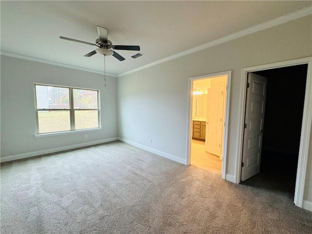 interior space with ceiling fan and ornamental molding