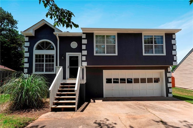 3620 Darwin Pl, Duluth, GA 30096 - view of front of home featuring stucco siding, an attached garage, and concrete driveway