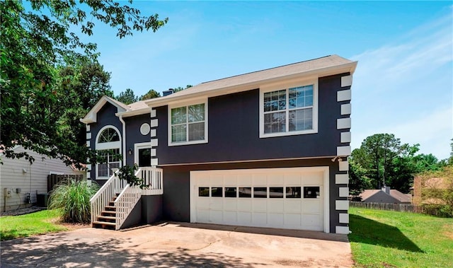 3620 Darwin Pl, Duluth, GA 30096 - raised ranch with stucco siding, concrete driveway, a garage, and a front lawn
