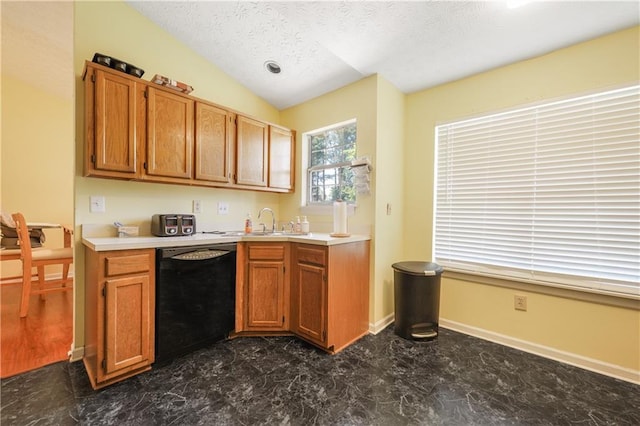3620 Darwin Pl, Duluth, GA 30096 - kitchen with black dishwasher, light countertops, vaulted ceiling, a textured ceiling, and dark marble finish floors