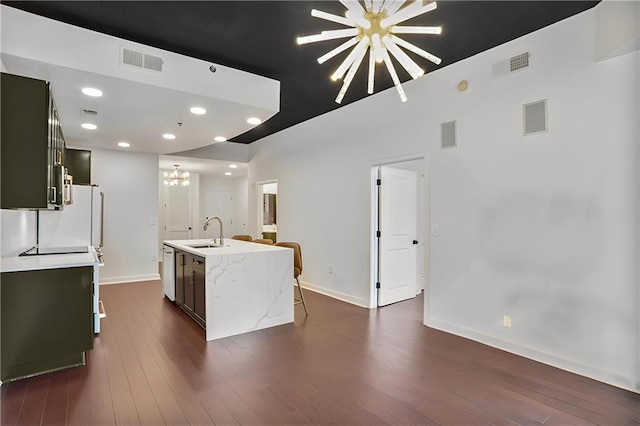 855 Peachtree St NE Unit 1108, Atlanta, GA 30308 - kitchen with a chandelier, a center island with sink, dark wood-style flooring, white dishwasher, and recessed lighting