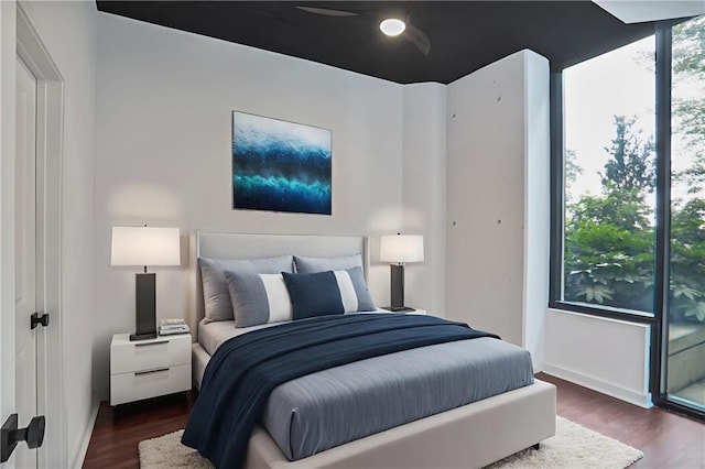 855 Peachtree St NE Unit 1108, Atlanta, GA 30308 - bedroom featuring dark wood-type flooring and baseboards