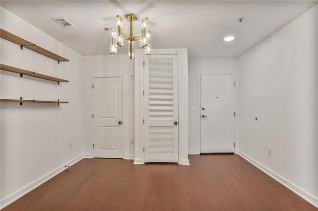855 Peachtree St NE Unit 1108, Atlanta, GA 30308 - unfurnished dining area featuring dark wood-style flooring and a chandelier