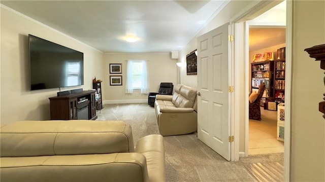 carpeted living room featuring ornamental molding