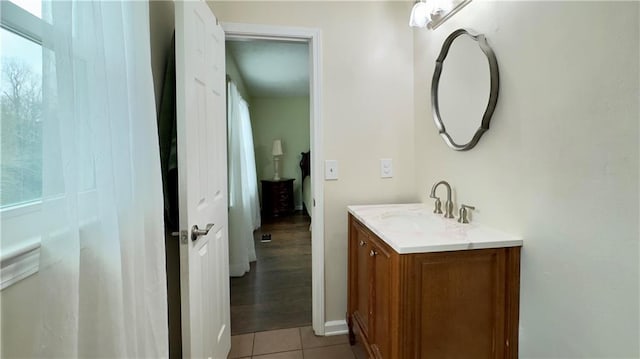 bathroom with tile patterned flooring and vanity