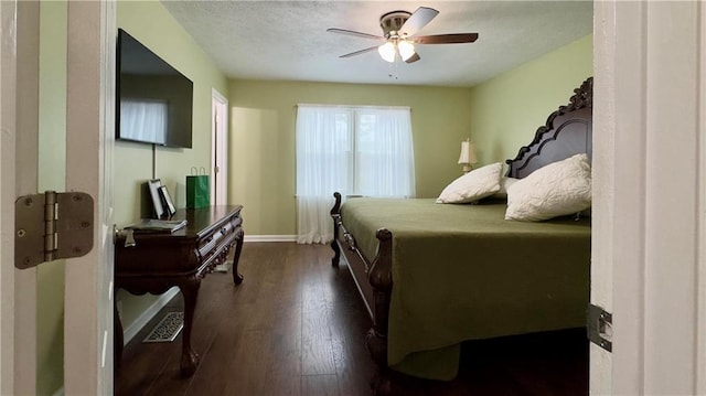 bedroom featuring ceiling fan and dark wood-type flooring