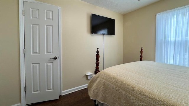 bedroom featuring dark hardwood / wood-style floors