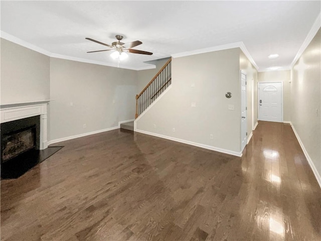 unfurnished living room featuring a ceiling fan, dark wood finished floors, a fireplace, baseboards, and stairs