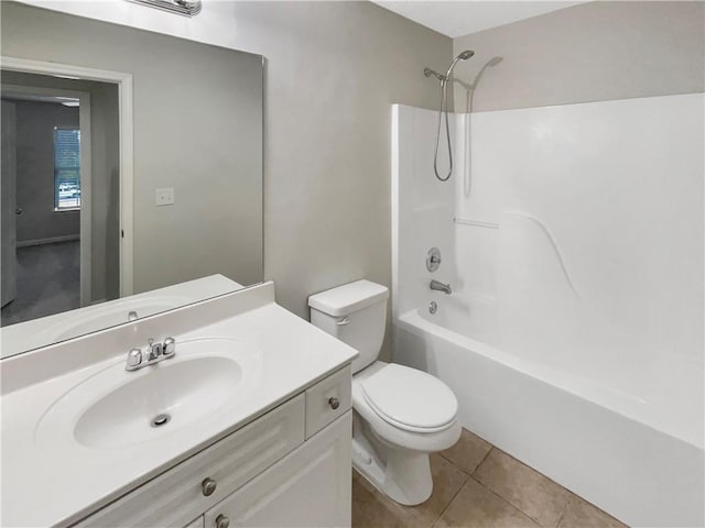 full bath with tile patterned flooring, toilet, vanity, and  shower combination