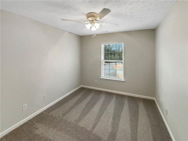 unfurnished room featuring baseboards, carpet floors, a textured ceiling, and ceiling fan