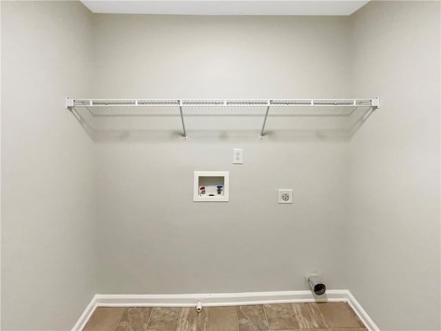 washroom with electric dryer hookup, baseboards, hookup for a washing machine, and laundry area