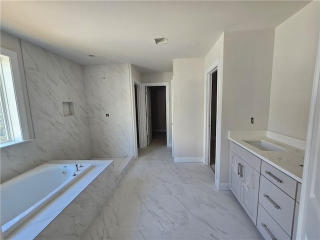 bathroom with baseboards, a shower, marble finish floor, vanity, and a bath