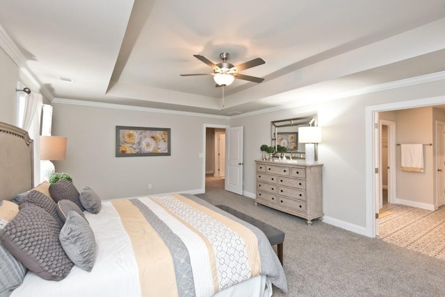 carpeted bedroom featuring visible vents, baseboards, a raised ceiling, ceiling fan, and crown molding