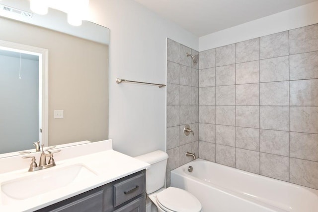 bathroom featuring toilet, shower / washtub combination, vanity, and visible vents