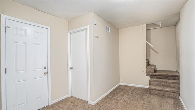 corridor with carpet flooring