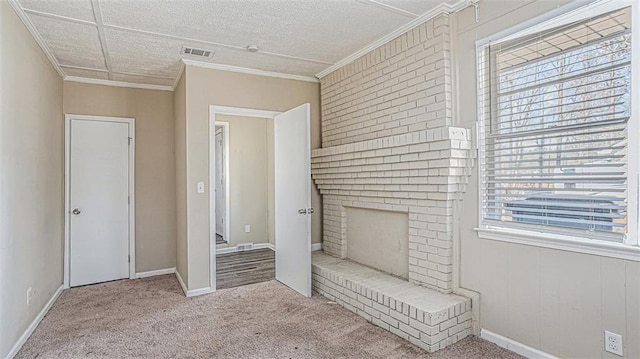 unfurnished bedroom with ornamental molding, a brick fireplace, and light carpet