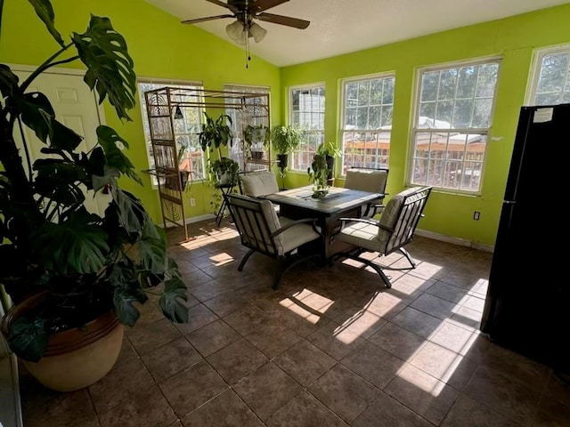 sunroom with lofted ceiling and ceiling fan