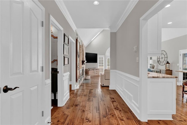 1313 Fallsbrook Ter NW, Acworth, GA 30101 - hall with crown molding, healthy amount of natural light, light wood-style floors, a wainscoted wall, and recessed lighting