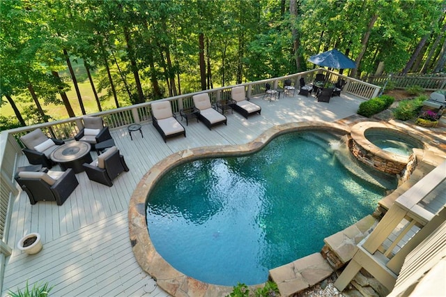1313 Fallsbrook Ter NW, Acworth, GA 30101 - view of swimming pool featuring a deck, an outdoor living space with a fire pit, and a pool with connected hot tub