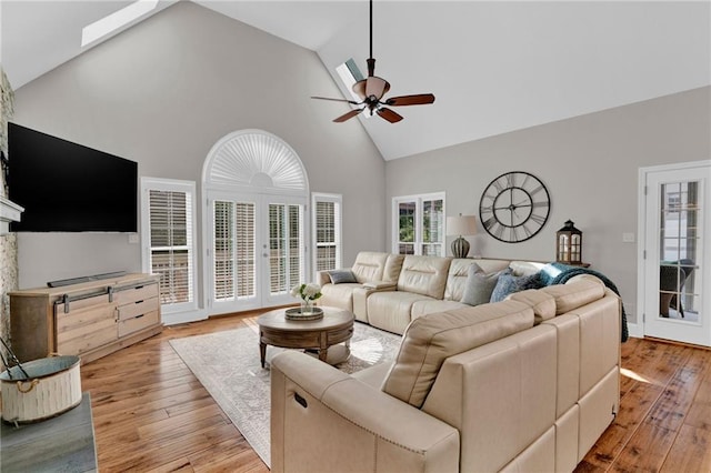 1313 Fallsbrook Ter NW, Acworth, GA 30101 - living room featuring high vaulted ceiling, ceiling fan, light wood-style floors, and french doors