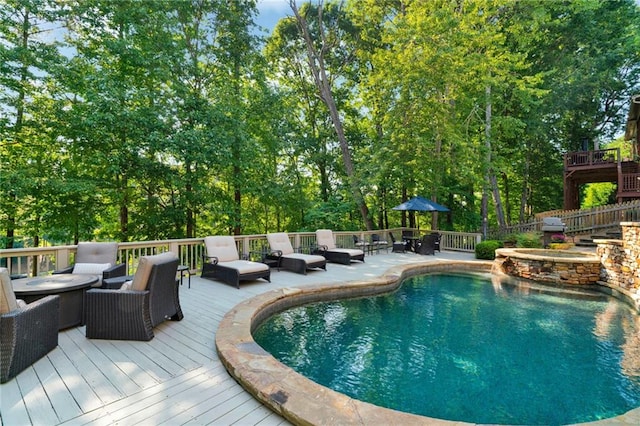 1313 Fallsbrook Ter NW, Acworth, GA 30101 - view of pool with a deck, an outdoor hangout area, a pool with connected hot tub, and view of wooded area
