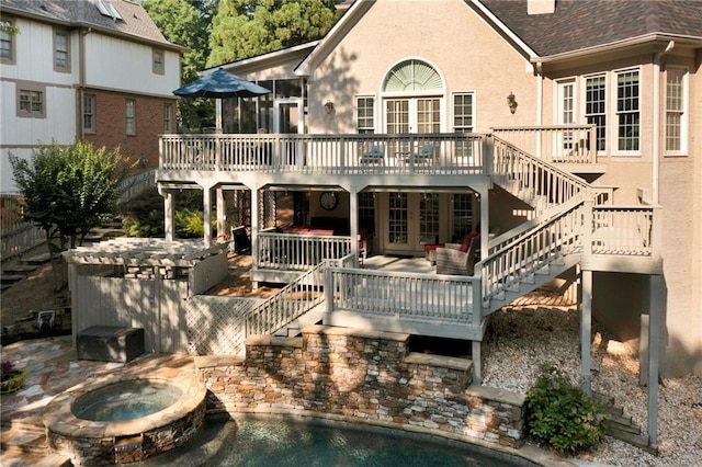 1313 Fallsbrook Ter NW, Acworth, GA 30101 - rear view of property with stairway, an in-ground hot tub, a wooden deck, and french doors
