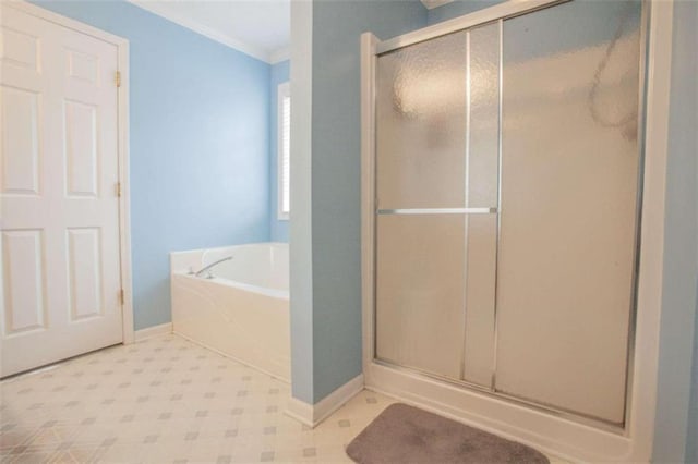 bathroom featuring crown molding and plus walk in shower