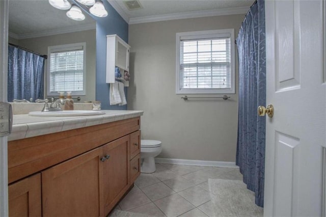 bathroom with ornamental molding, toilet, vanity, and tile patterned floors