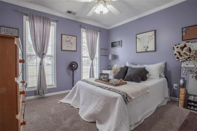 carpeted bedroom featuring ceiling fan, multiple windows, and ornamental molding