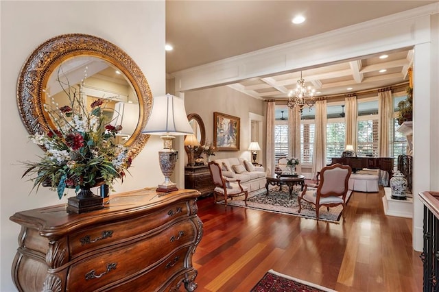 living area featuring coffered ceiling, an inviting chandelier, crown molding, beam ceiling, and hardwood / wood-style floors