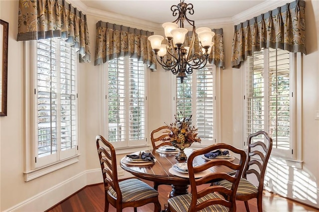 dining space featuring crown molding, a healthy amount of sunlight, and dark hardwood / wood-style floors