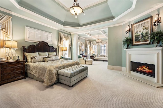 bedroom featuring a tray ceiling, crown molding, and carpet