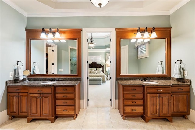 bathroom with vanity, crown molding, and tile patterned floors