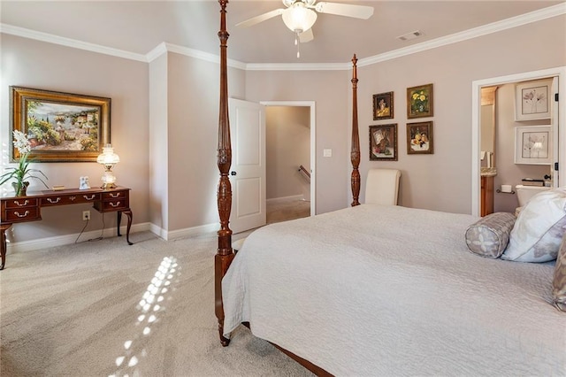 bedroom with crown molding, light colored carpet, ensuite bathroom, and ceiling fan