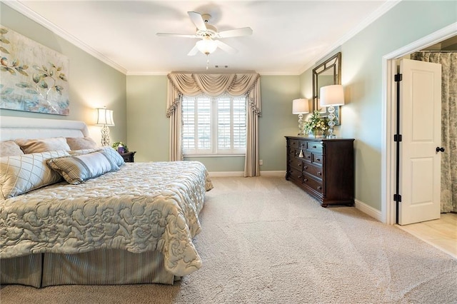 carpeted bedroom with crown molding and ceiling fan