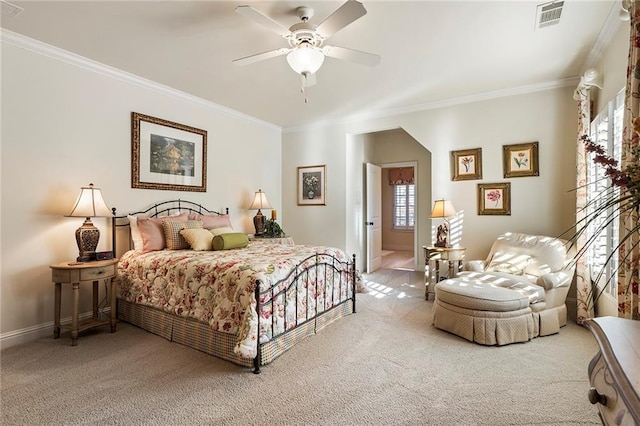 bedroom with crown molding and carpet flooring