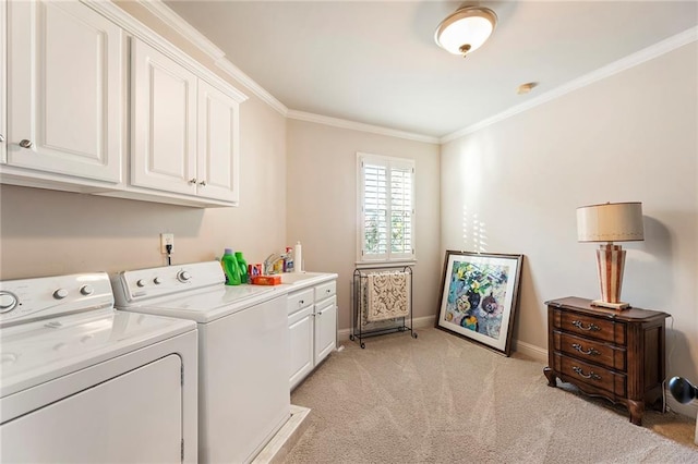 clothes washing area featuring sink, cabinets, ornamental molding, separate washer and dryer, and light carpet