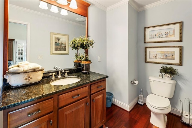 bathroom with hardwood / wood-style flooring, vanity, ornamental molding, and toilet