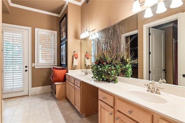 bathroom featuring crown molding, tile patterned floors, and vanity