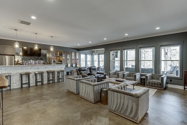 6014 Warpath Rd, Flowery Branch, GA 30542 - living area with finished concrete floors, crown molding, recessed lighting, and baseboards